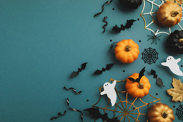 istock Halloween party border decorations from pumpkins, bats, spider web, ghosts on dark blue background top view. Happy Halloween template flat lay. 2230053515