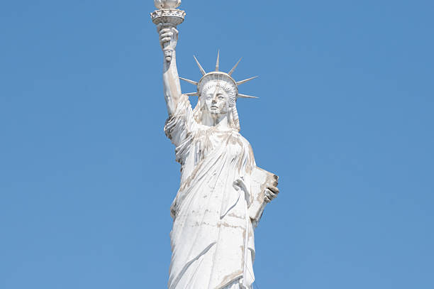 Paris, France - 1983: A vintage 1980's Fujifilm negative film scan of the replica copper green statue of liberty in Paris, France.