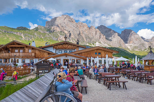 Val Gardena, Italy-July, 2022: People at a restaurant in the Alps