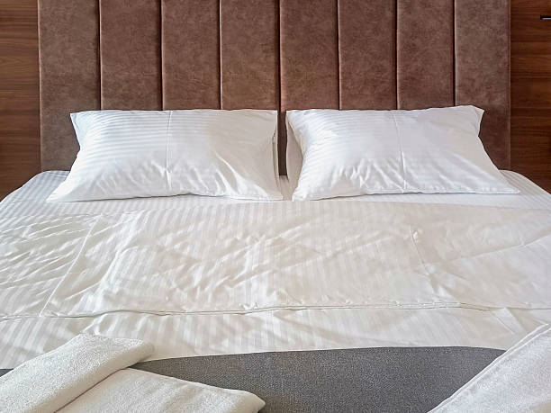 istock A made bed in a hotel room. Close-up. 2230062330