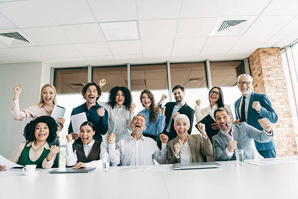 istock Cheerful team celebrating success in office collaboration with optimistic energy 2230065380