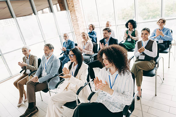 istock Team Members Engaged in an Office Presentation with Applause and Collaboration During a Workplace Conference 2230065422