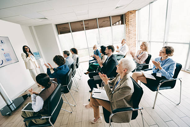istock Diverse professionals attending an engaging business presentation in a modern corporate conference room setting 2230065431
