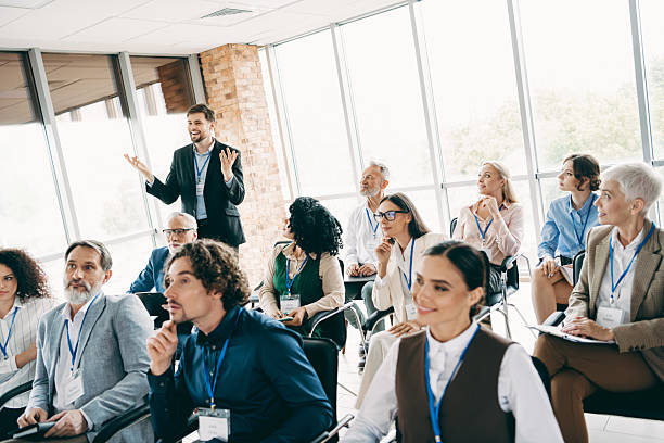 istock Diverse group of professionals attending a business workshop in a modern office setting emphasizing teamwork 2230065466