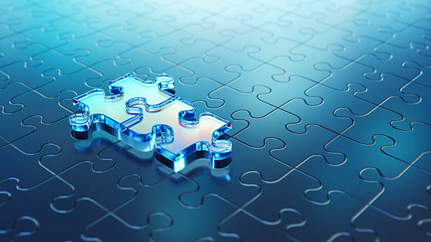 istock Two Unique Blue Transparent Puzzle Pieces On a Fitted Blue Puzzle Background 2230067412