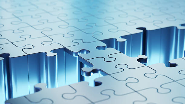 istock Blue metallic jigsaw puzzle with an abstract bridge over the empty space with missing pieces and bright reflections 2230067446