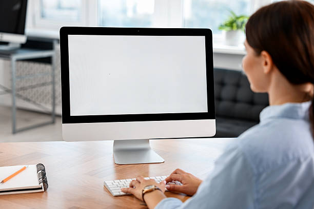 istock Woman working on computer at table in office 2230075195