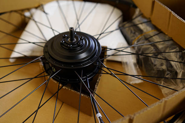 istock New electric bicycle wheel components unpacked and organized on a workspace for assembly and installation 2230081154