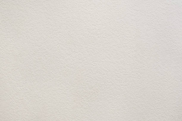 istock Wall painted with raw white plastic paint with a uniform crushed drop effect 2230082126