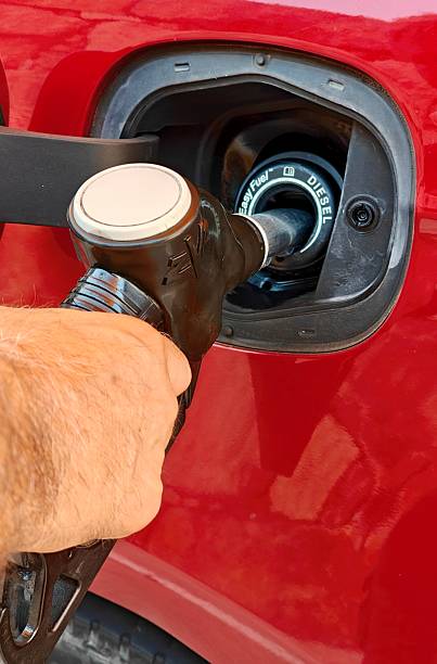 istock Refueling gasoline in a red car. 2230084695