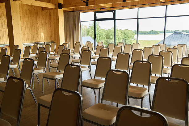 istock A Spacious and Empty Conference Room with Comfortable Chairs Carefully Arranged in Neat Order 2230087519