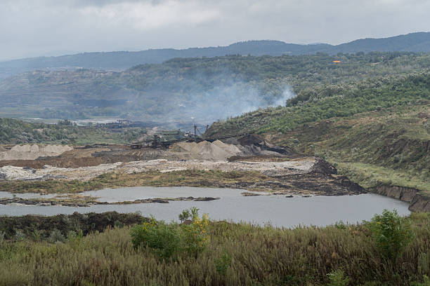istock Excavators working in Kolubara open pit coal mine polluting the environment in Serbia 2230088731