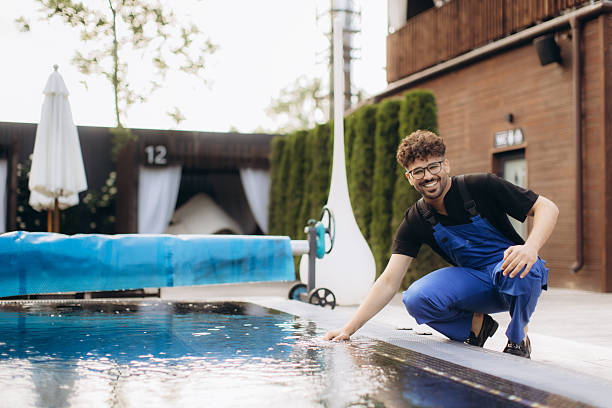 istock Pool maintenance worker checking water quality in luxury hotel resort 2230088824