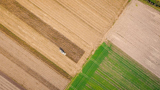 istock Aerial view on combine, harvester machine, harvest ripe maize 2230090180