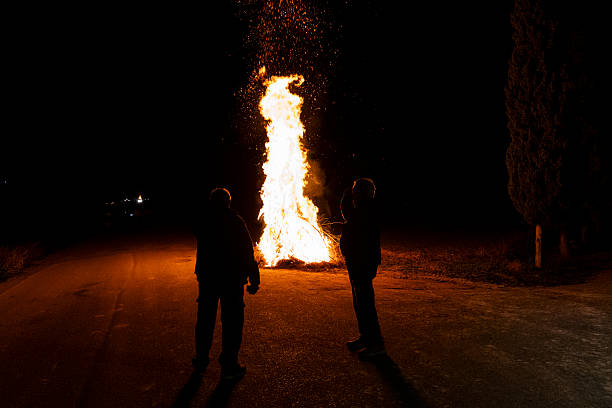 Firefighters with fire in the background