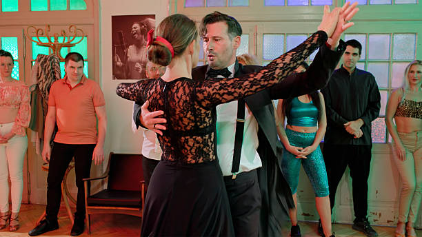 istock Elegant Couple Performing Ballroom Dance Steps In Studio Class 2230097514