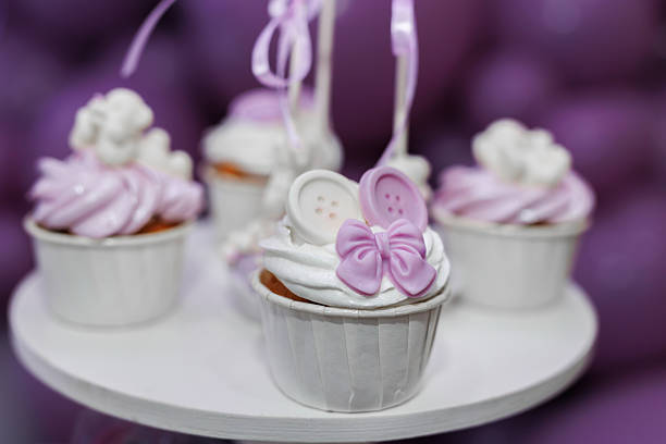 Purple cupcakes with decor for birthday party in restaurant