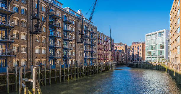 Warehouse apartments overlooking a dock on the River Thames in central London, UK.