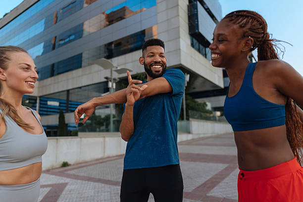 istock Group of Friends Exercising Outdoors Together 2230103269