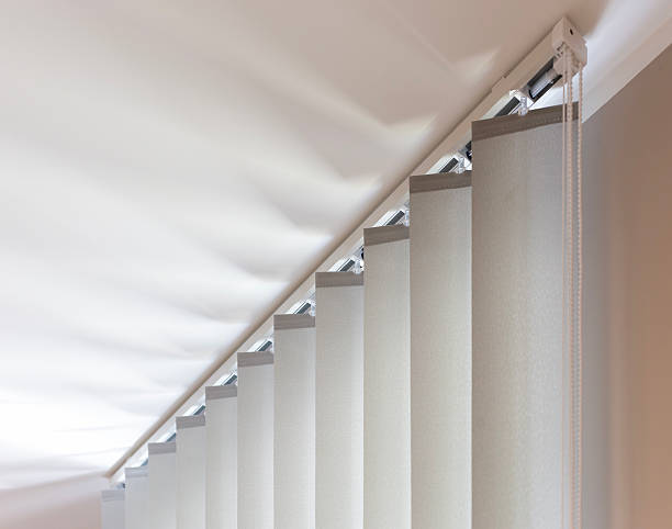 istock Top Section of Beige Vertical Blinds with Rail and Control Chain 2230106024