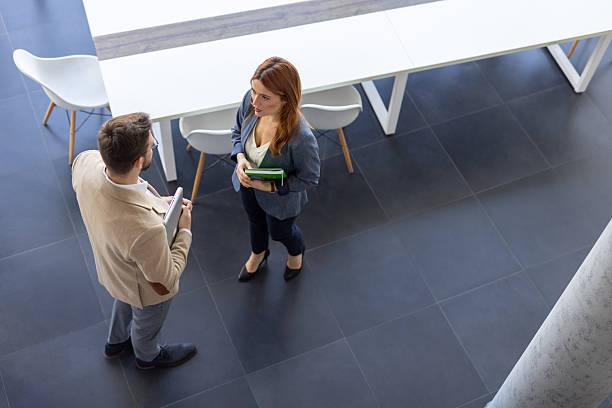 istock Stylish Office Scene with Two Professionals Meeting 2230111956