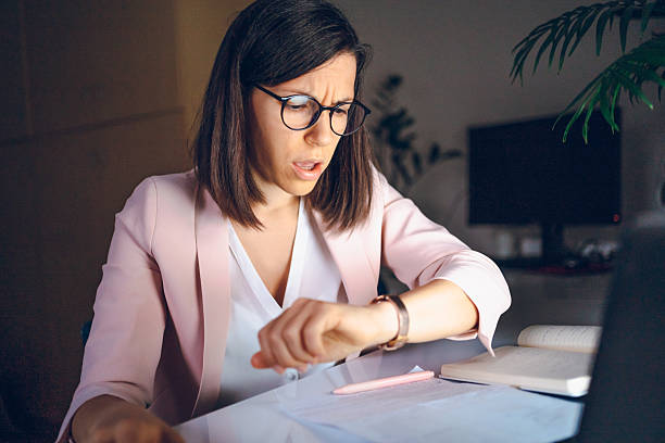 istock Business woman working at night 2230118579