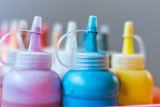 Close up transparent bottle acrylic paint