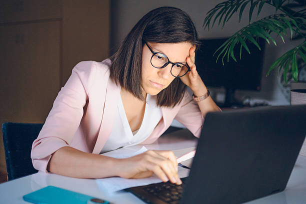 istock Business woman working at night 2230118998