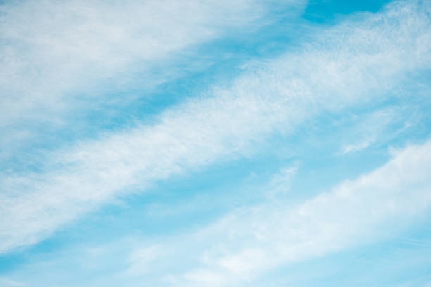 Wispy Streaky Clouds in Blue Sky. Cirrus or Cirrostratus Cloud Formation