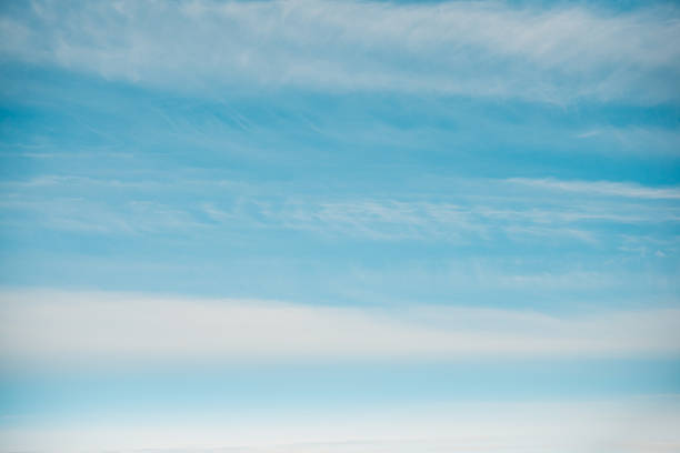 istock Wispy Streaky Clouds in Blue Sky. Cirrus or Cirrostratus Cloud Formation 2230122332