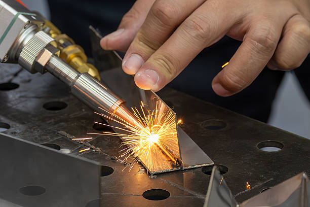 istock Close up scene the laser welding process by hand held laser welding machine. 2230126688
