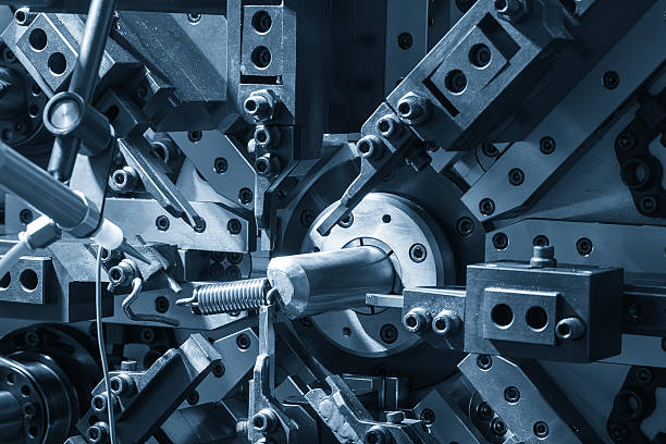 istock Close up operation of the wire coil spring making machine in the blue tone. 2230126696
