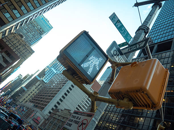 istock Green Pedestrian Traffic Light and Skyscrapers 2230128169