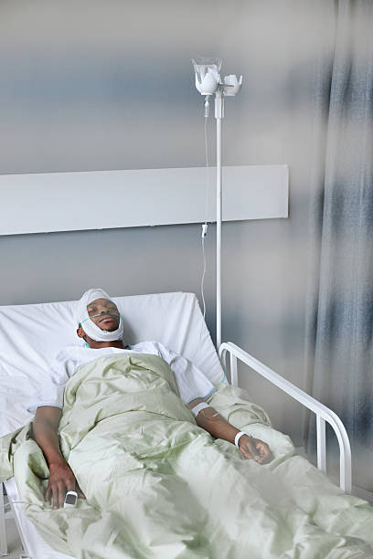 istock Injured Man Sleeping In Hospital Ward 2230129975