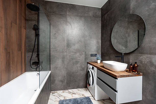 istock A bathroom with a sink, mirror, and a washer 2230131991