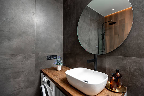 istock A bathroom with a sink, mirror, and a washer 2230132303