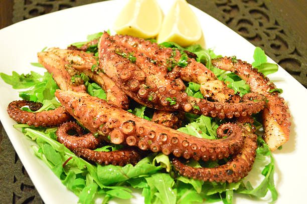 istock Grilled Octopus Salad with Fresh Arugula and Lemon 2230133722