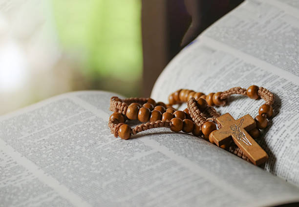 istock Wooden Jesus Cross on Old Book 2230136465