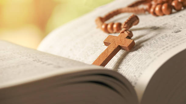istock Wooden Jesus Cross on Old Book 2230136467