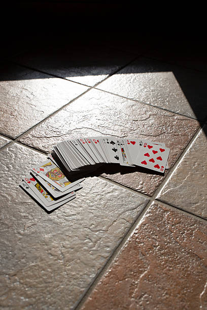istock Playing cards scattered wildly across the floor, playing poker 2230136861