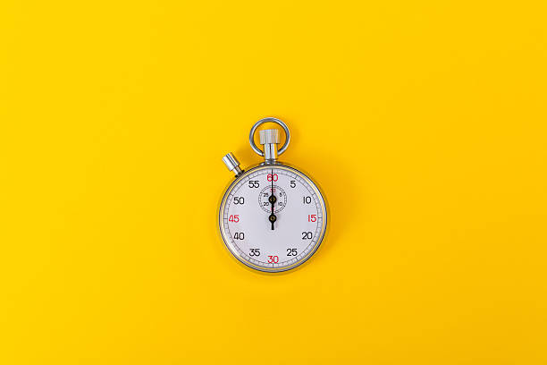 istock A stopwatch on yellow background 2230138991