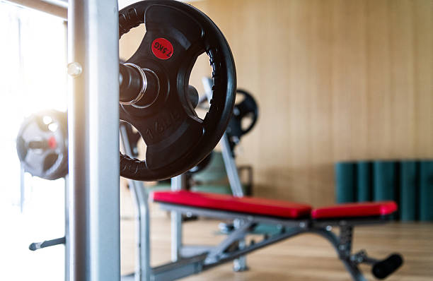 istock Modern gym with bench press equipment 2230139238