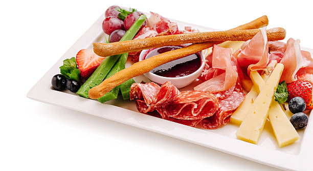istock Exquisite gourmet platter featuring assorted meats, cheeses, and fruits 2230140396