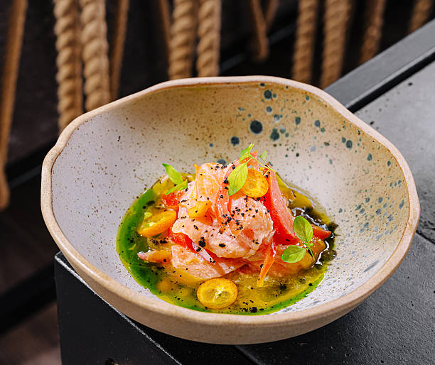 istock Fresh salmon dish with herbs and citrus in a unique bowl presentation 2230141339