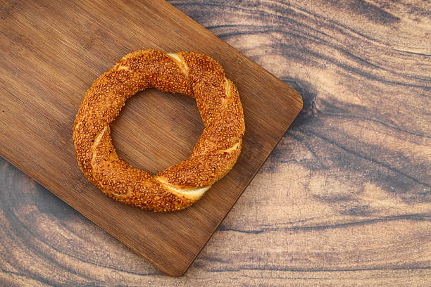 istock Turkish traditional bagel / simit with sesame on rustic table, turkish breakfast pastry concept 2230143195