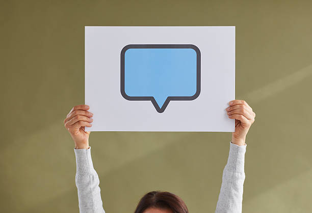 istock Paper card with blue copy space speech balloon or message bubble in woman's hands 2230143549
