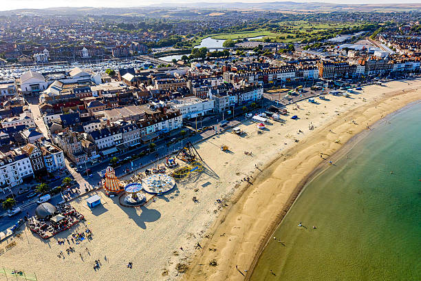 istock Summer Funfair on the Beach at Weymouth, England 2230143785