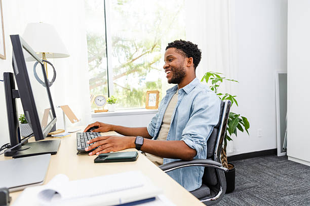 istock Happy African American Man Working on Computer in Home Office 2230145856