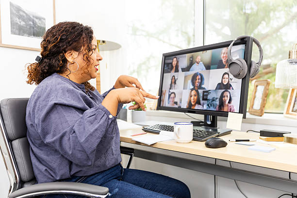 istock Woman Leading a Virtual Team Meeting on Computer 2230145911