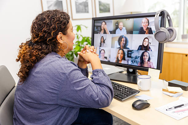 istock Woman in Video Conference with Diverse Team 2230145963